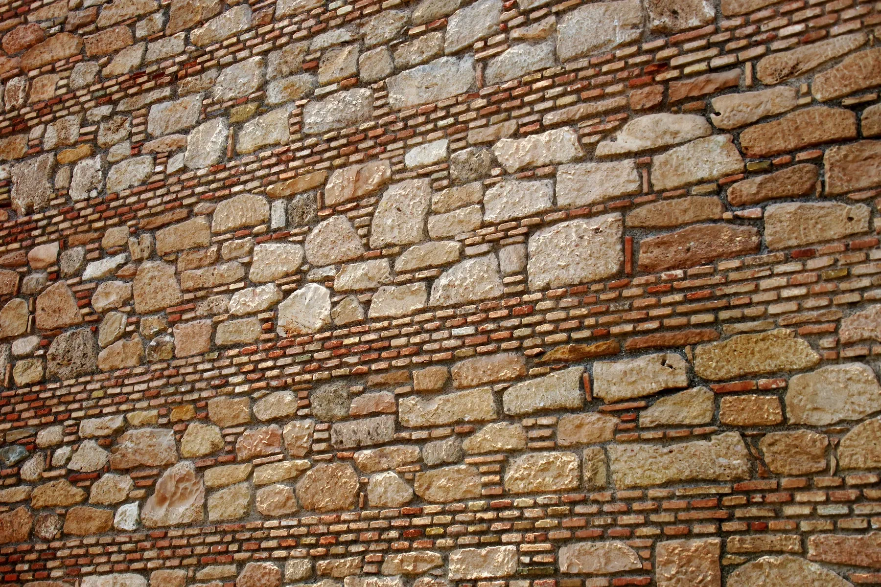 Dry-stack stone garden wall and planted edge in Canberra