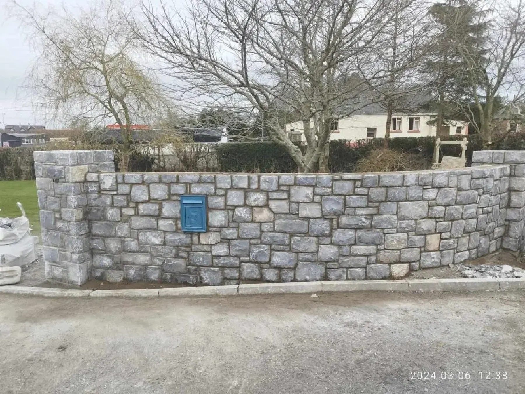 Sandstone retaining wall built into a Canberra garden
